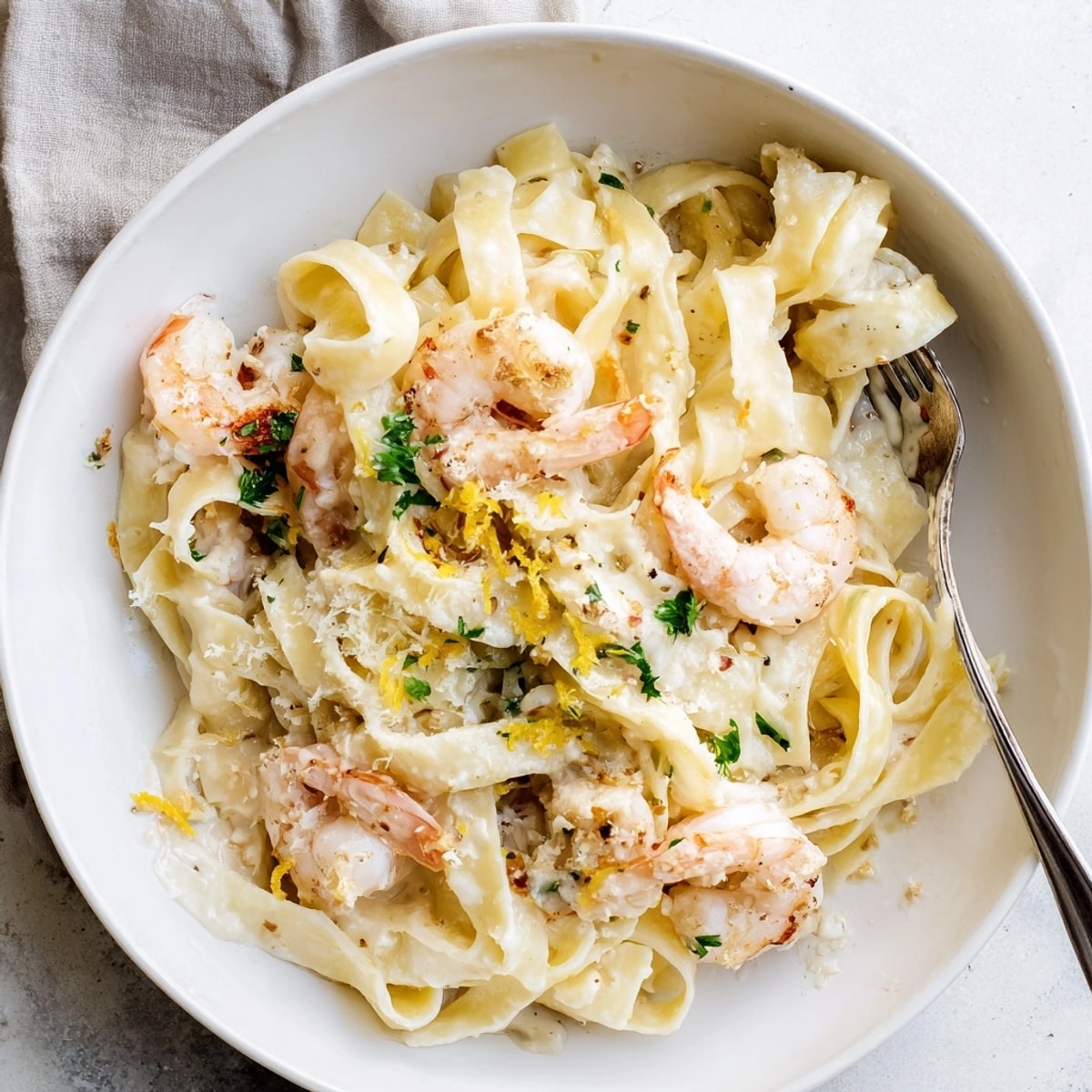 Close-up of luscious One-Pot Garlic Butter Shrimp Pasta, garnished beautifully, freshly served.