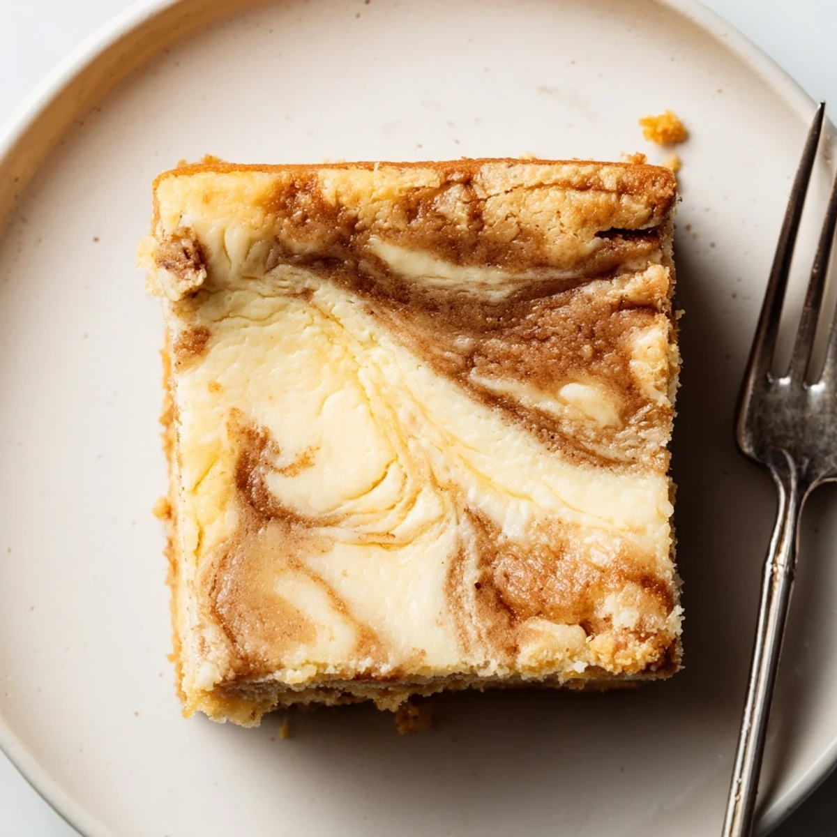 Indulge in Spiced Sweet Tea Cheesecake Blondies with a creamy swirl and lemon zest.  