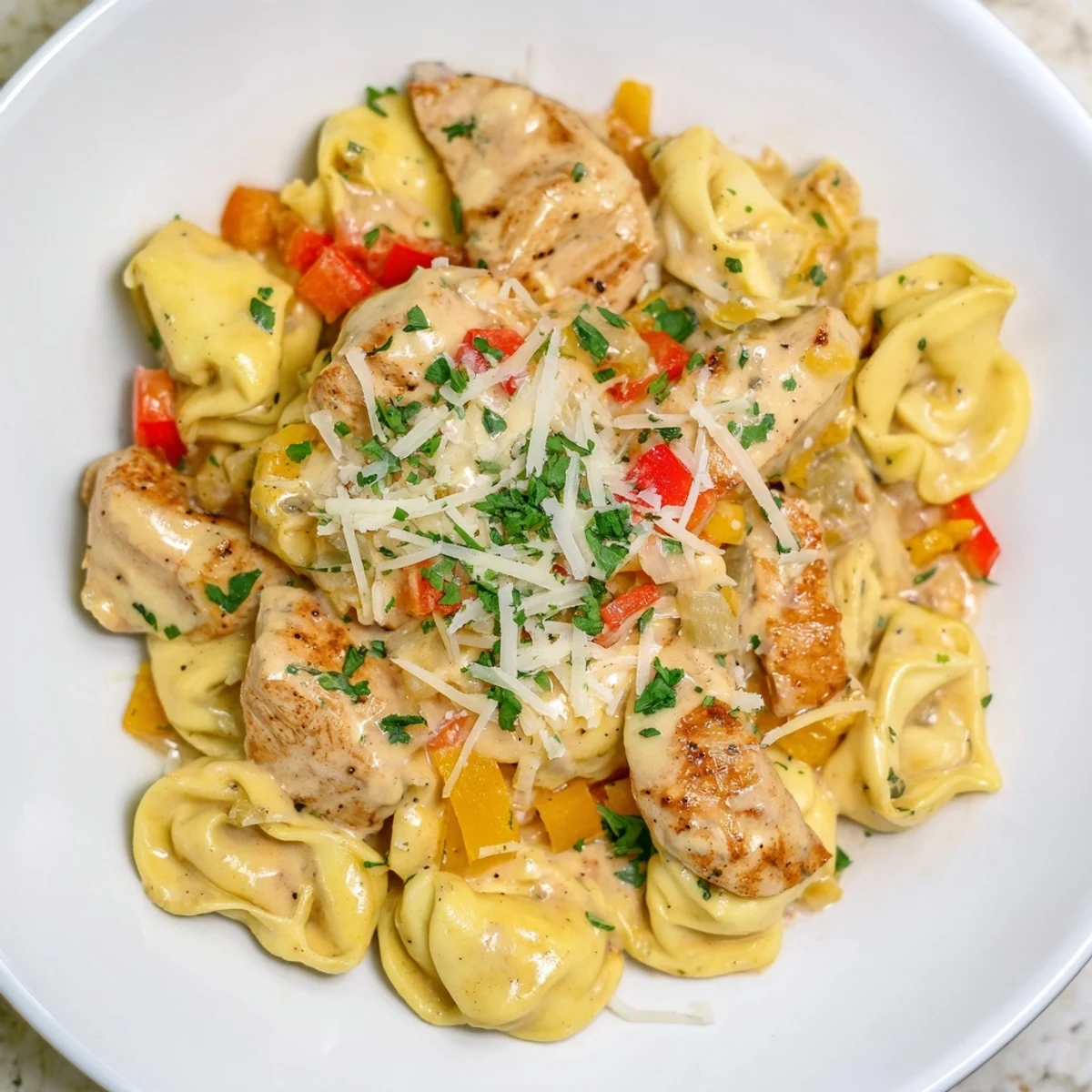Imagine the rich sauce: Zesty Cajun Garlic Parmesan Chicken Tortellini with tender chicken and cheesy pasta.