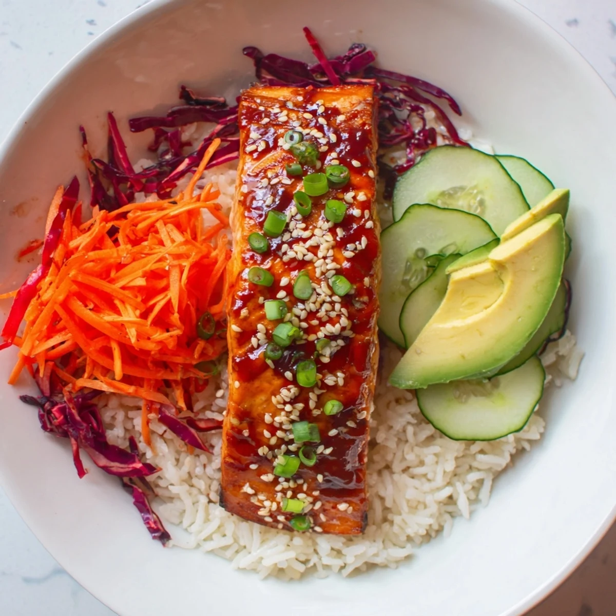 Sweet Chili Salmon Rice Bowl with glistening glaze, vibrant veggies, and fluffy rice ready to enjoy.