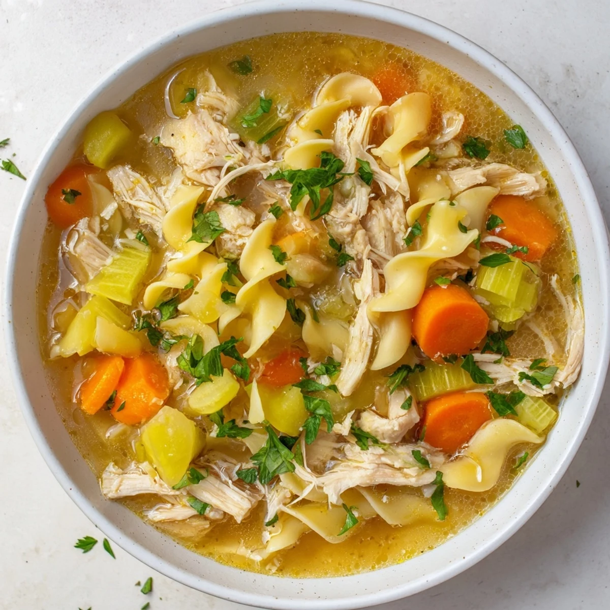 Hearty homemade chicken noodle soup, a classic comforting American meal, perfect for a cold evening.
