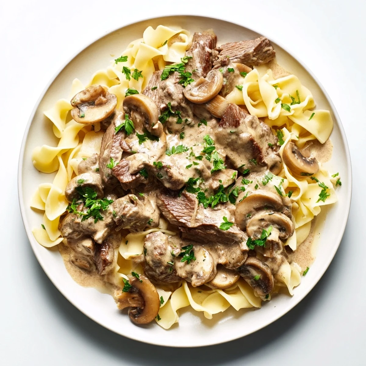 A close-up of savory mushroom beef stroganoff, showcasing the rich, creamy sauce and tender beef.