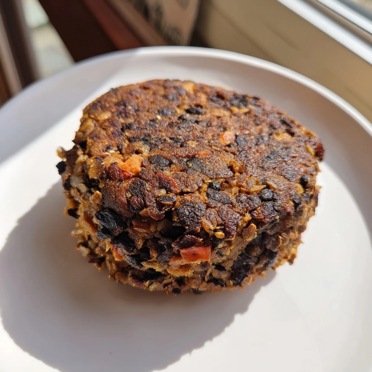 Golden-brown black bean burgers ready to be enjoyed, piled high with fresh, colorful toppings.