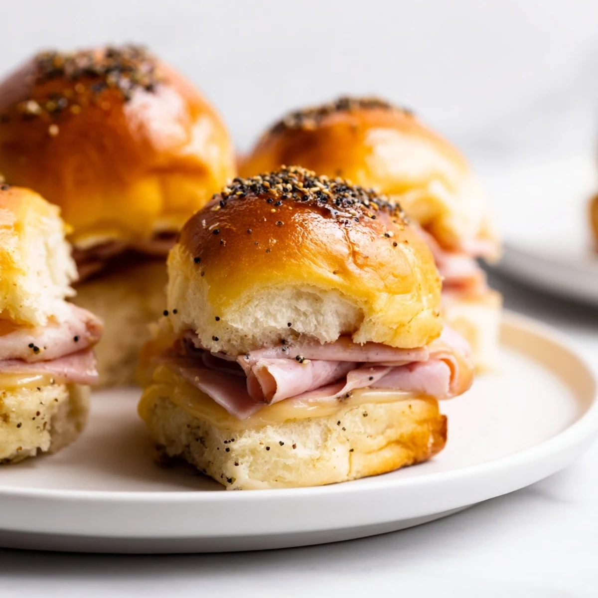 Baked Ham and Cheese Party Sliders, golden and bubbly, perfect for a game day spread.