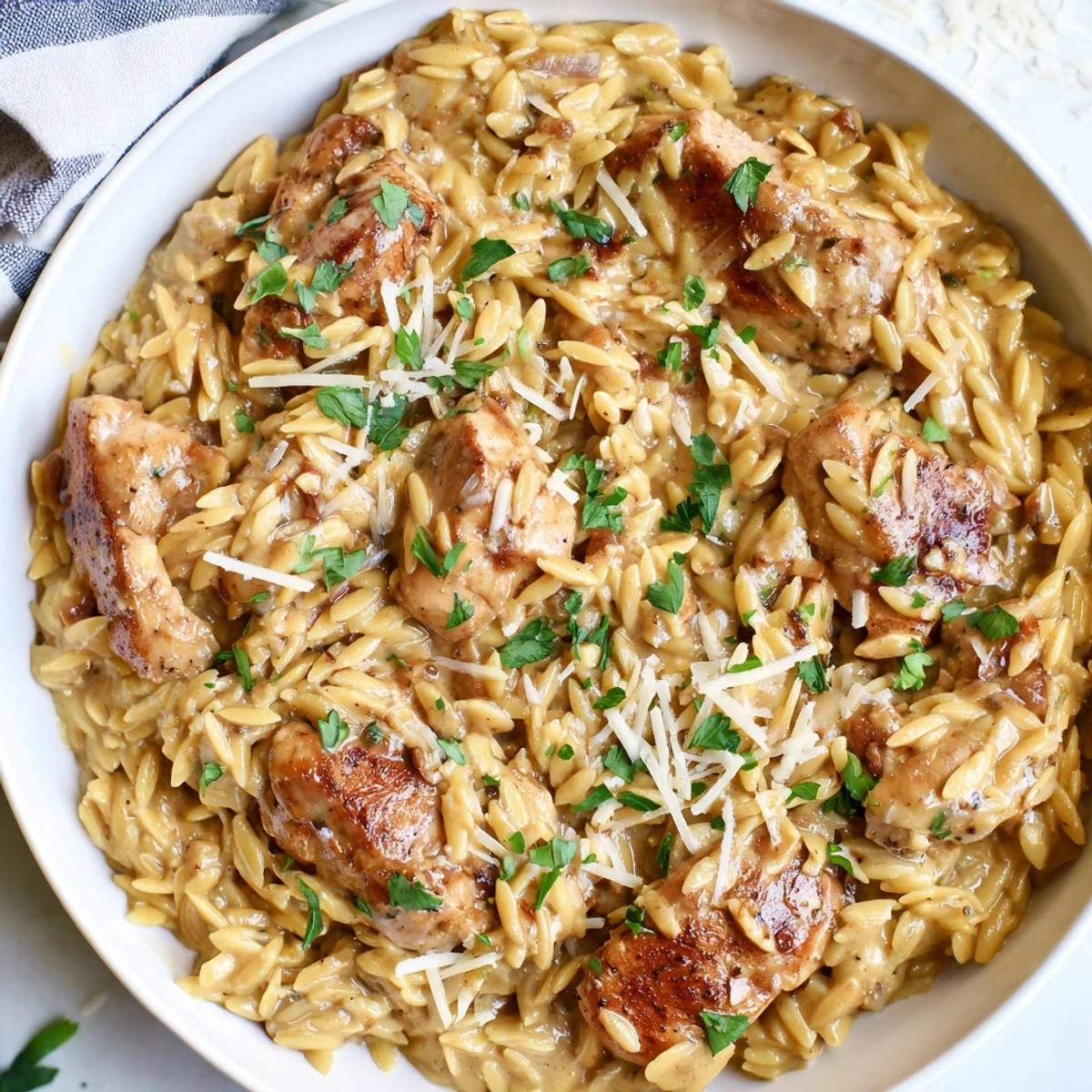 Savor the flavors of easy One-Pot Cajun Chicken Alfredo Orzo—a creamy, zesty weeknight favorite meal.