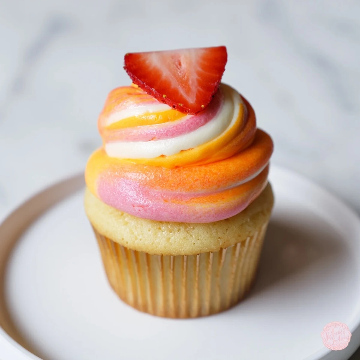 Summer-ready Mango Strawberry Sunset Cupcakes, with vibrant layers and a sweet strawberry jam filling.