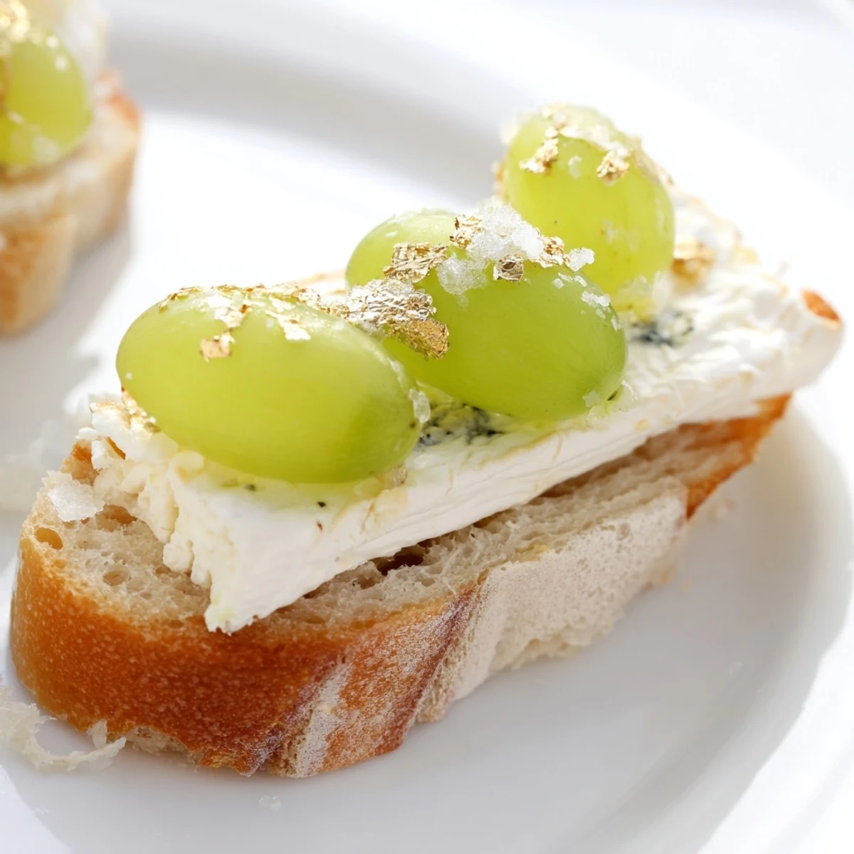 Delicate slices of creamy cheese topped with bubbly grapes create stunning sparkling Champagne toasts.