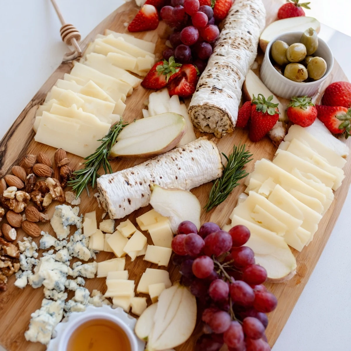 An artful waterfall edge grazing board: a beautifully arranged appetizer featuring tempting snacks.
