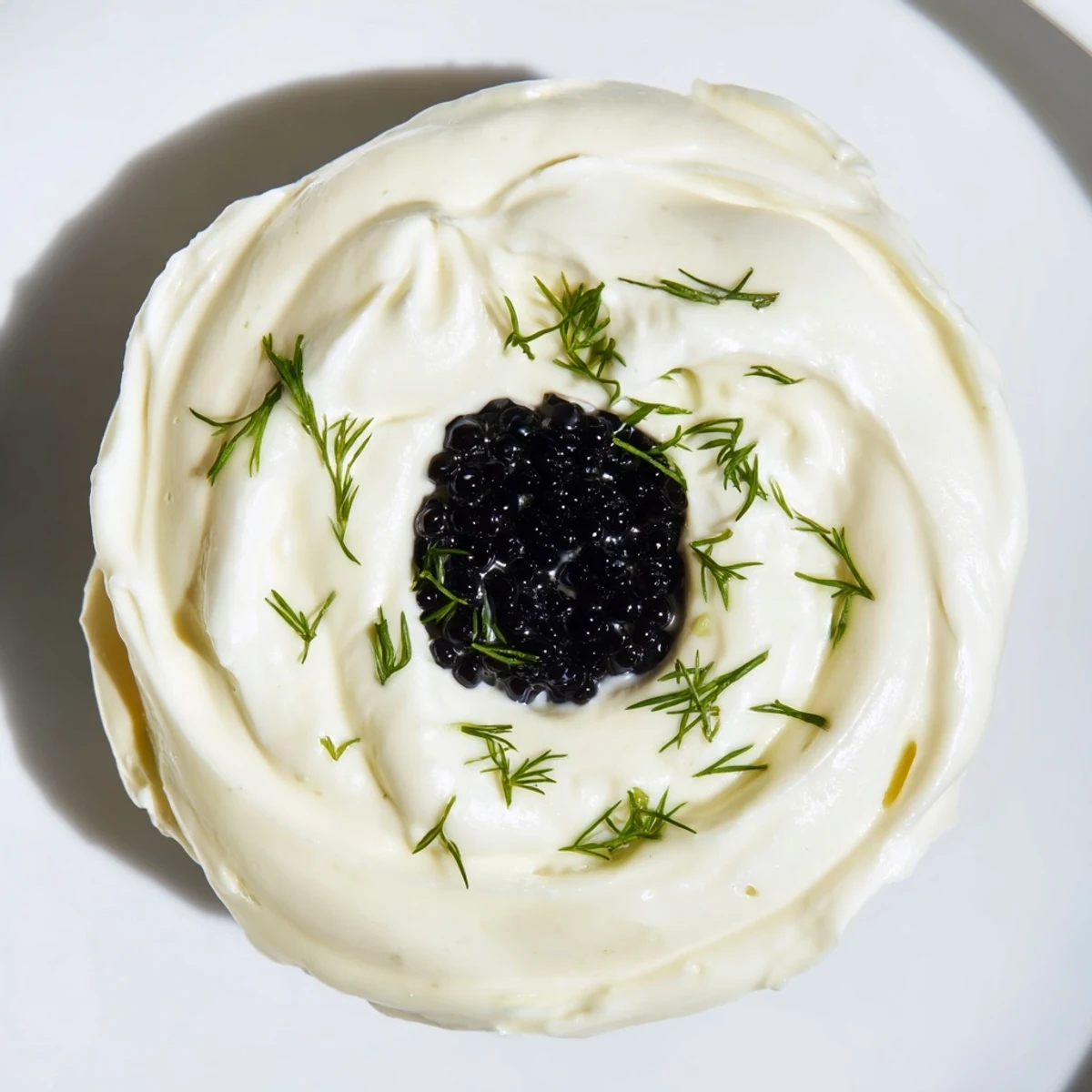 Elegant Diamond Inlay appetizer: a glistening diamond of caviar atop creamy whipped cheese, ready to serve.