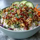 Colorful Spicy Bang Bang Turkey Rice Bowls garnished with fresh cilantro and sesame seeds, ready for a quick weeknight dinner.  