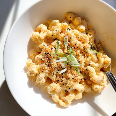 Bold and creamy Spicy Kimchi Mac & Cheese topped with crunchy sesame panko.  