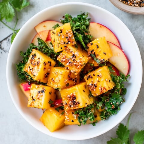 Vibrant Sunlit Glade salad showcasing juicy mango and pineapple, a refreshing vegan lunch.