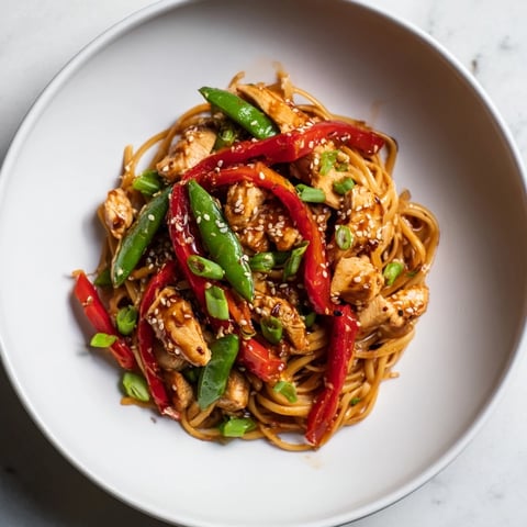 Steaming hot Sesame Hoisin Ground Chicken Pasta, a flavorful dinner tossed with tender chicken and veggies.