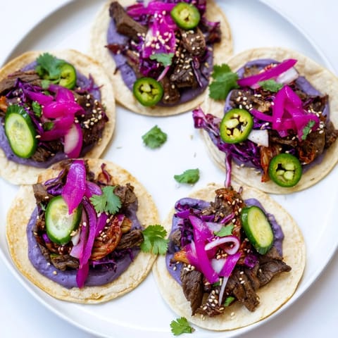 Flavorful bowls filled with marinated protein and colorful toppings, inspired by global cuisines.  