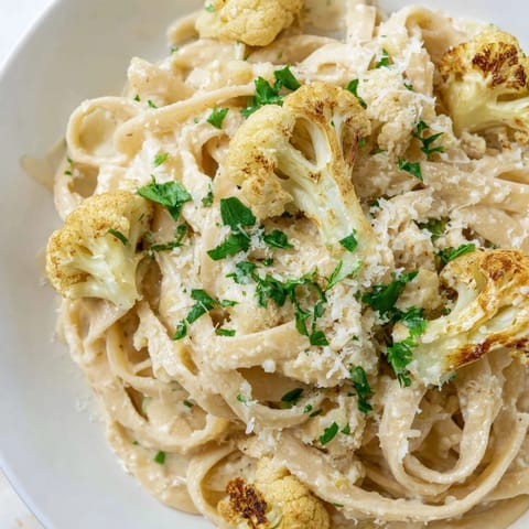 In this vegetarian Italian-inspired dish, roasted cauliflower and garlic blend into a velvety sauce for Roasted Cauliflower Alfredo, perfect for a light dinner.  