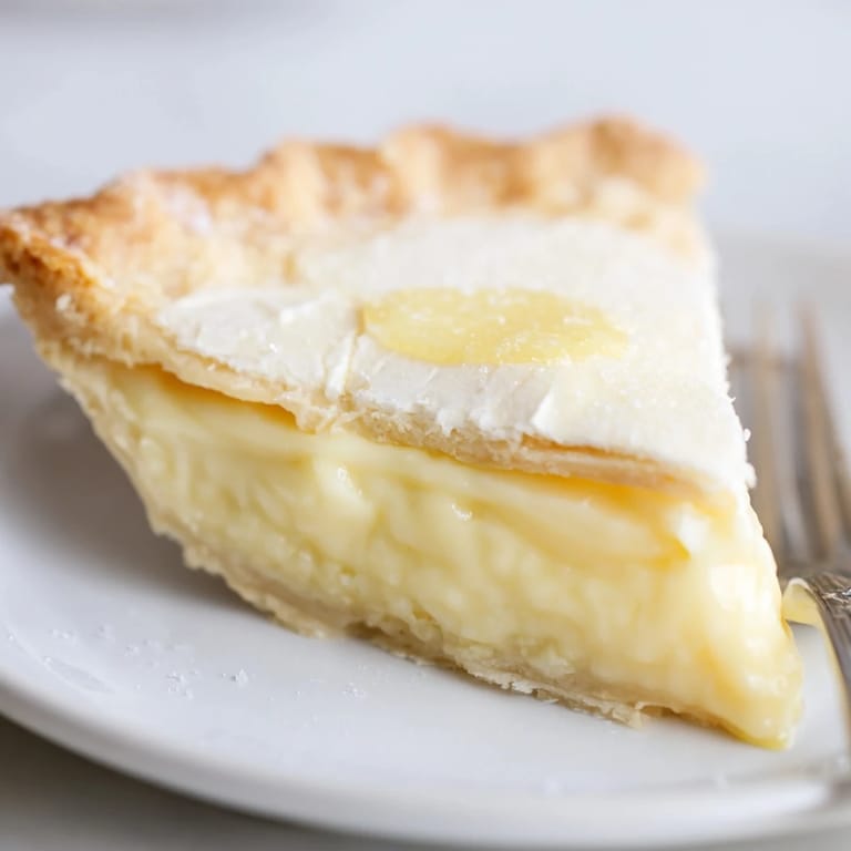 Nostalgic water pie dessert, showcasing a custard-like filling and crisp, sugary edges.