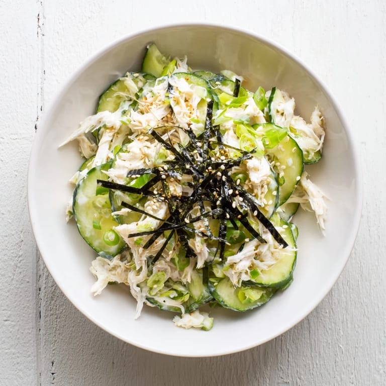 Thinly sliced cucumbers tossed in sesame mayo with imitation crab in this easy California Roll Cucumber Salad, ready to serve with nori.